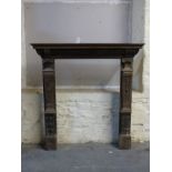 A carved oak fireplace by repute originally from Cheney Walk, the house designed by C R Ashbee,