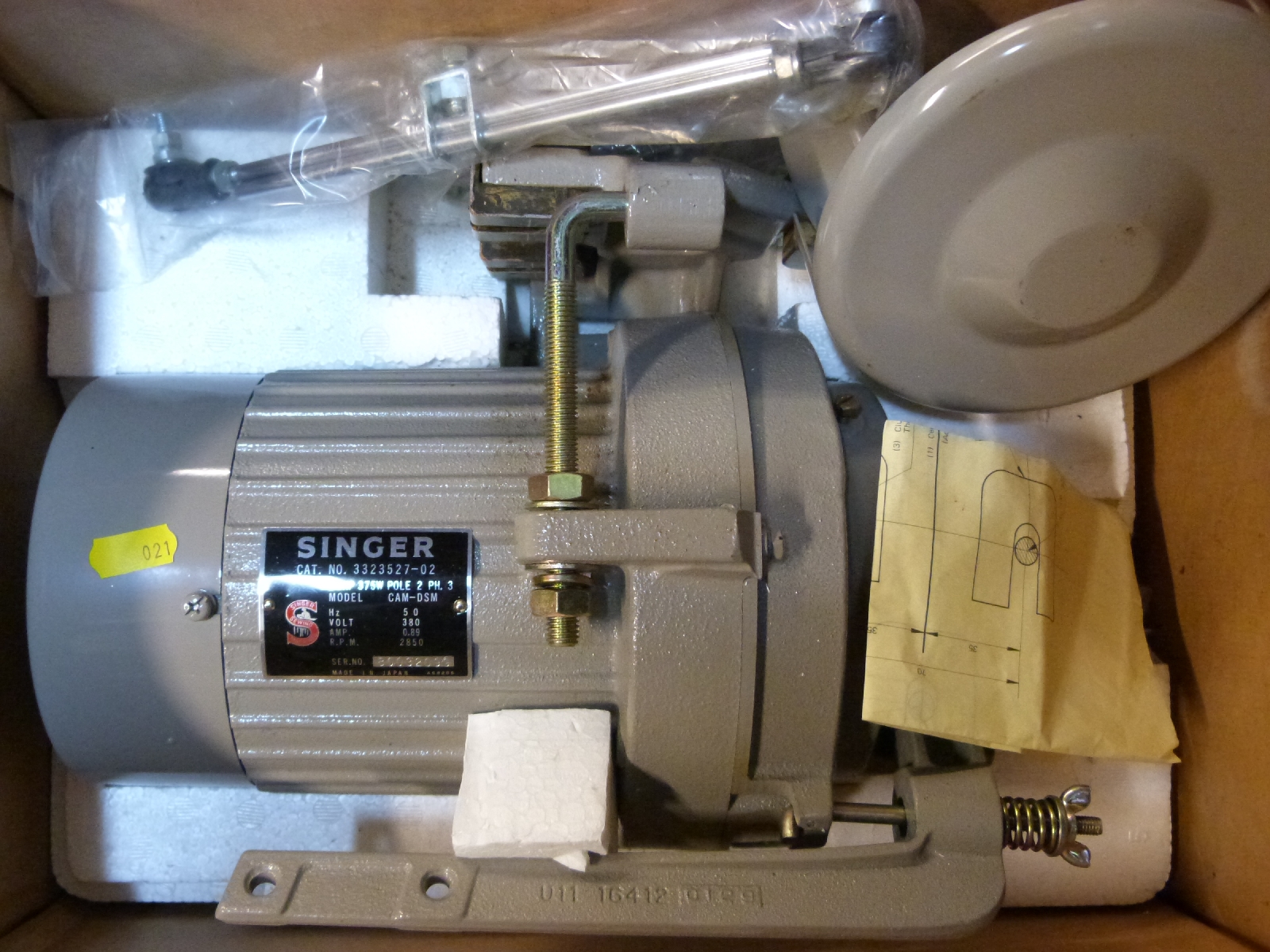 A Singer sewing machine unused ½ HP electric motor in box with instruction leaflet