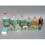 A quantity of vintage advertising Eau De Cologne bottles and two sealed bottles of perfume