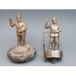 Two policeman car mascots, one on a radiator cap,