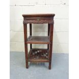 A Chinese side table with a pierced shelf below and single drawer,