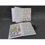 A stockbook of mint GB stamps and two stockbooks of used stamps, Victoria - QEII,
