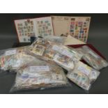 A box of GB and foreign stamps, loose and in albums, together with first day covers.