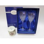 A pair of boxed cut glass Royal Doulton wine glasses and a Royal Worcester money box