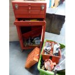 A garage tool chest on cabinet with contents including pullers, spanner,