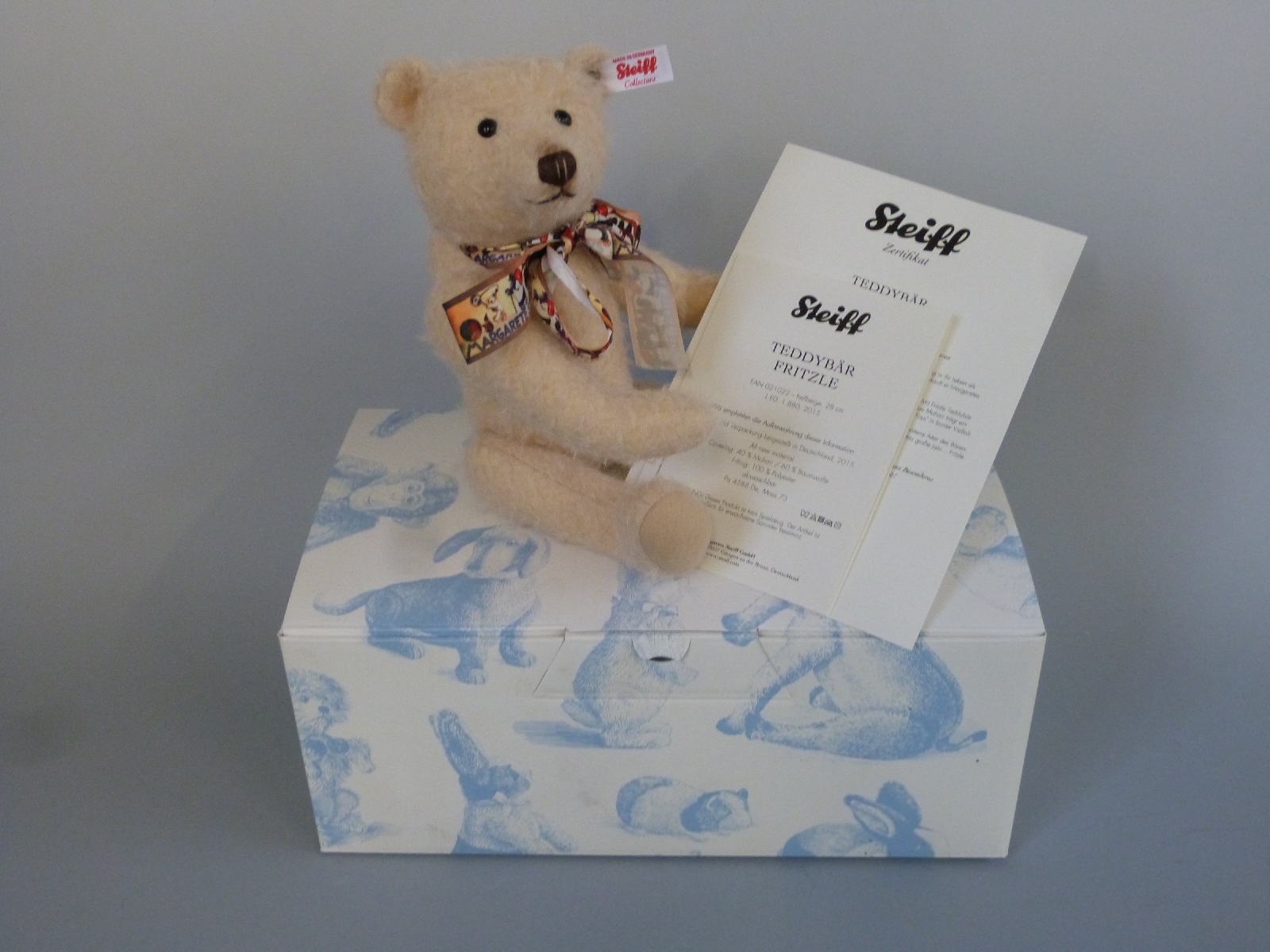 Steiff Teddy Bear Fritzle with beige mohair, decorated ribbon bow and jointed limbs,