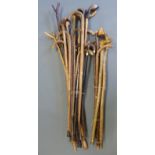 A large collection of walking sticks, thumb sticks,
