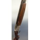 Lanber 12 bore over and under ejector shotgun with scrolling engraving to the lock,