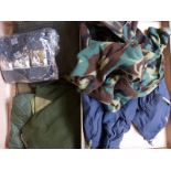 A collection of sporting/ outdoor clothing in a case including a waxed jacket, unopened items,