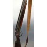 Merkel 12 bore side by side shotgun with engraved locks, chequered grip and forend,