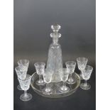 A cut glass liqueur set,