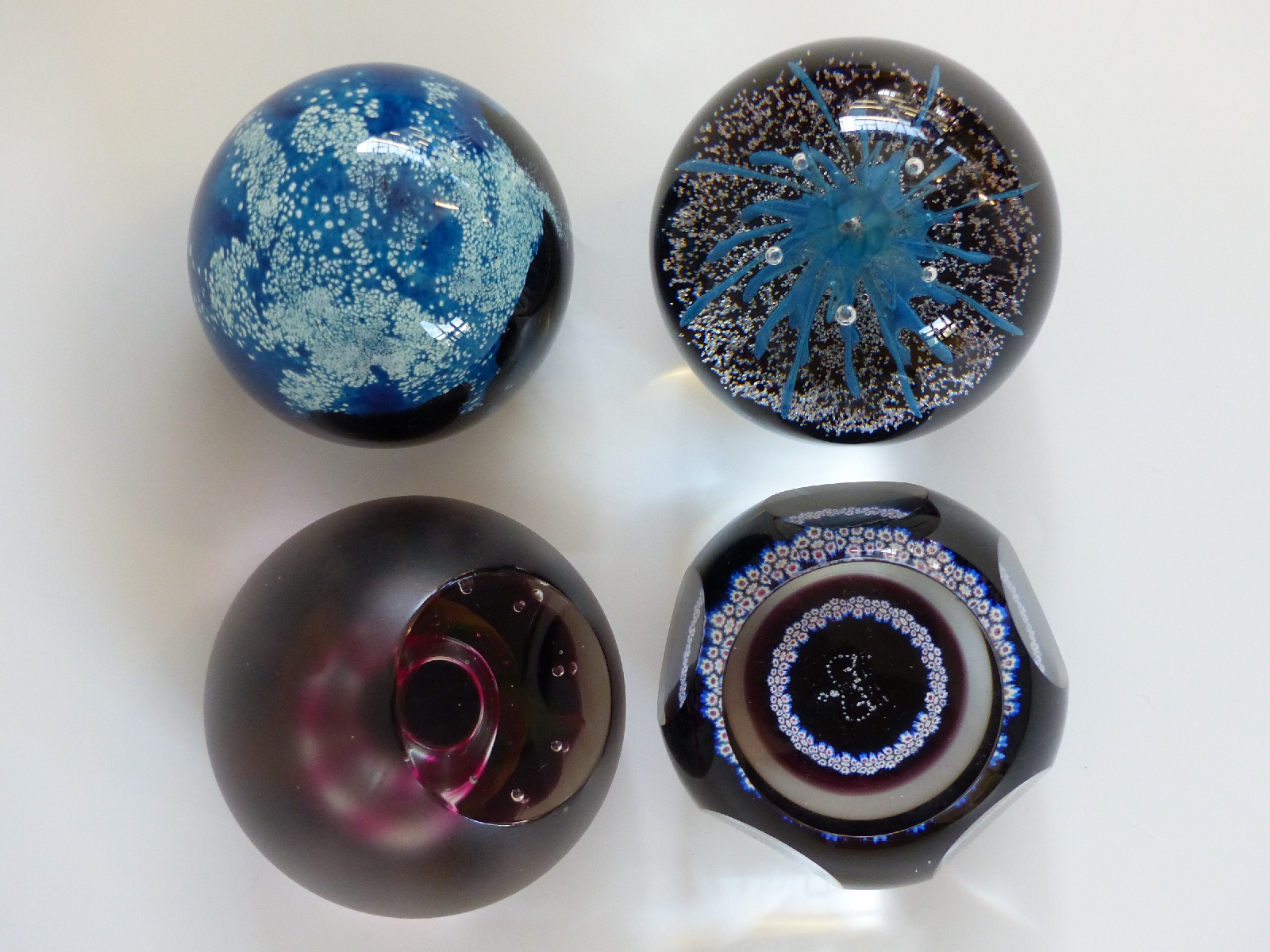 Four Caithness Glass limited edition Colin Terris designed paperweights Space Flower 77/100,