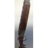 Baikal 27E-IC 12 bore over and under ejector shotgun with chequered grip and forend, engraved lock,