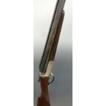 Master 12 bore side by side shotgun with chequered grip and forend, raised ball sight,