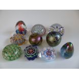 A collection of millefiori and iridescent paperweights including John Deacons Bull, Strathearn,