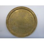 A brass tray with Islamic decoration,