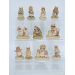 Twelve Border Fine Arts Brambly Hedge figures with 11 tins