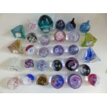 Twenty nine Caithness glass paperweights and paperweight clocks including Collectors' Society,