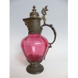 A pewter mounted cranberry glass claret jug,