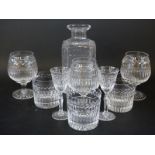 A partial suite of Stuart Crystal drinking glasses comprising decanter, three tumblers,