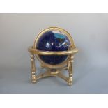 A hardstone / specimen inlaid globe