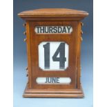A large early 20thC mahogany haberdashery / office / factory or shop perpetual calendar,