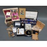 A collection of costume jewellery including watches, brooches, crystal necklace, Ronson lighter,