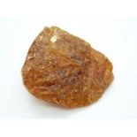 A large piece of raw uncut copal amber, 86 x 46 x 69mm, 131g.