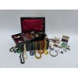 A collection of costume jewellery including beads, glass necklace, mother of pearl necklace,
