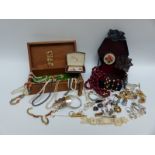 A collection of costume jewellery including jet brooch, silver fob, white metal pot, silver bangle,