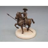 A bronze figure of a Spanish horseman / caballero on alabaster base, 11.