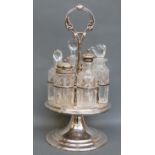 A silver plated six bottle cruet with cut glass bottles,