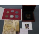 A cased double crown 9ct gold coin commemorating the canonisation of Pope John Paul II together