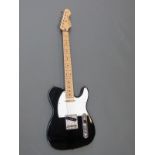 Vintage brand reissued Series V2 electric guitar in black gloss finish with white finger board,