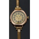 9ct gold ladies wristwatch with black hands, gold face,