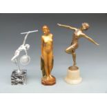 A spelter figure of an Art Deco dancer, a figure of a nude and a nude warrior / dancer,