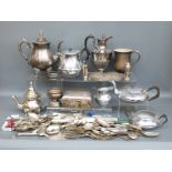 A collection of silver plated items including tea sets, cutlery, tankard,