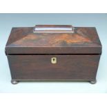 A 19thC rosewood tea two division tea caddy with hinged interior compartments and space for a