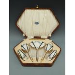 A cased dressing table set with guilloché enamel decoration and Goldsmiths,