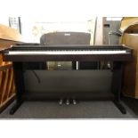 Yamaha YDP-131 digital piano.