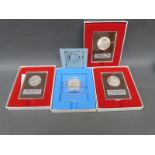 Four cased sterling silver proof coins including Peace Enduring,