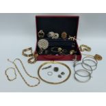 A collection of jewellery to include a silver bangle, costume jewellery, silver rings,