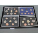 Four Royal Mint brilliant uncirculated coin sets 1982, 1984,