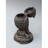 A 19thC carved bog oak owl inkwell,