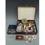 A quantity of collectable items including car badges, penknives, cigarette lighters, lapel badges,