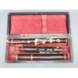 Beare & Son, London 19thC 'improved' rosewood flute with nickel keys,