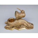 A 19thC bronze inkwell in the form of a walrus with hinged head,