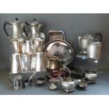 A collection of pewter and silver plated ware including Arts and Crafts style hammered items
