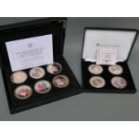 Two cases of Queen Elizabeth II commemorative gold plated picture coins,