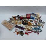 A collection of costume jewellery to include brooches, cufflinks, necklaces, Tissot watch,